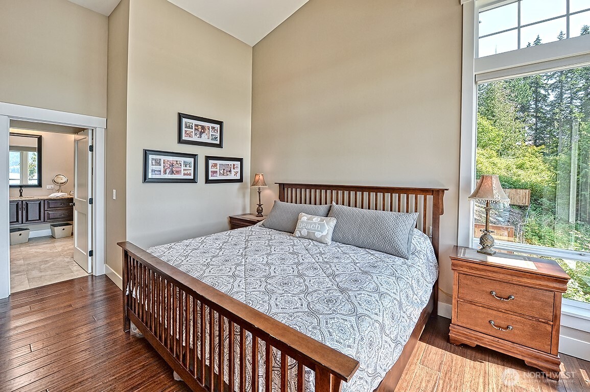 3042 North Shore Road Bellingham, WA 98226 - Photo 25 of 35 a bedroom with a bed and wooden floor