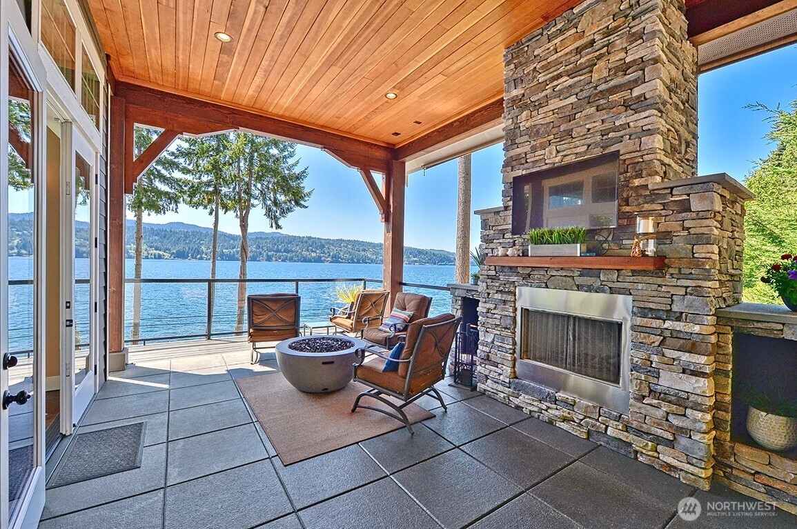 3042 North Shore Road Bellingham, WA 98226 - Photo 3 of 35 a outdoor space with patio the couches and a fireplace