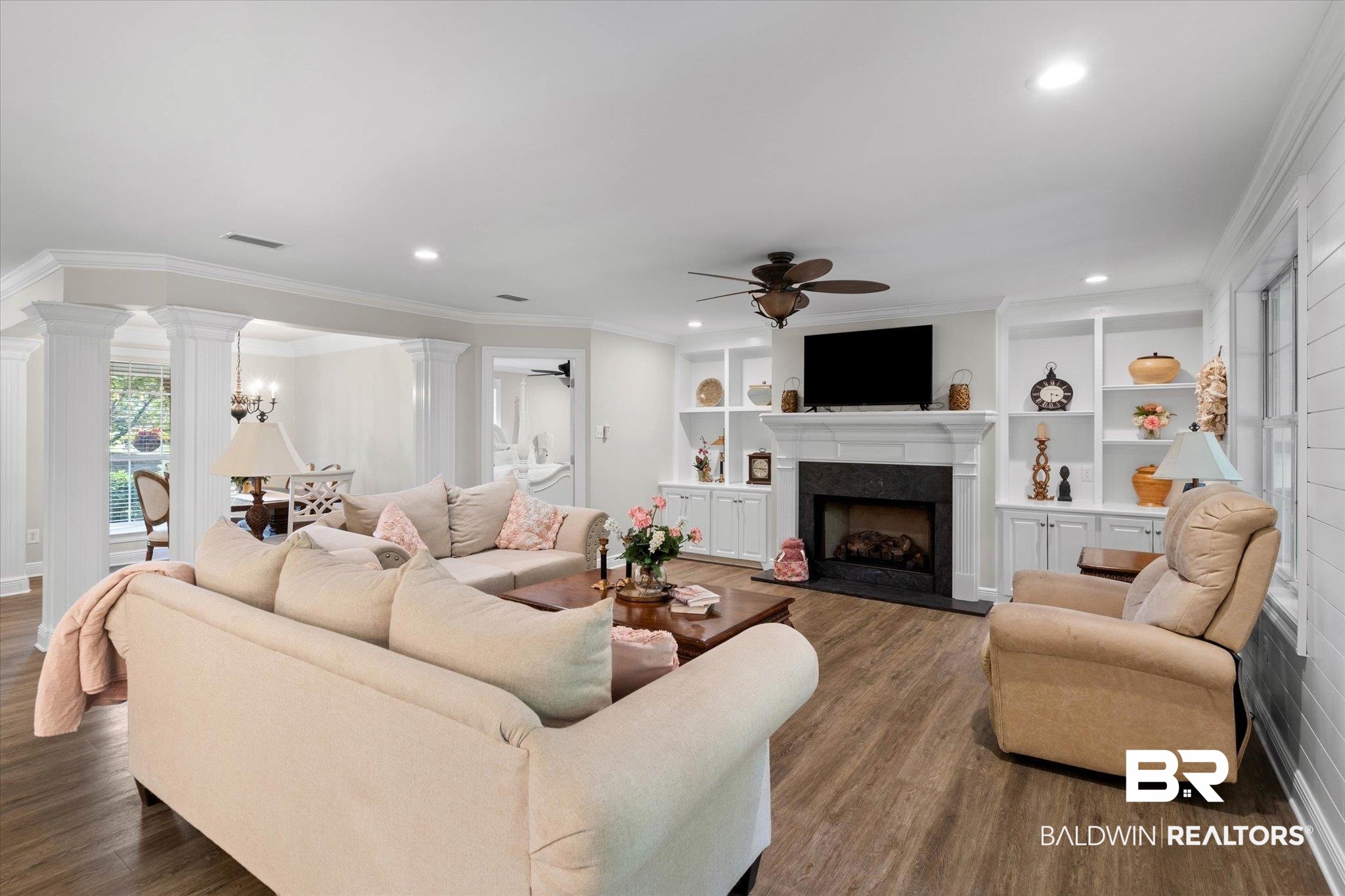 3715 Latigo Road Mobile, AL 36695 - Photo 6 of 39 Living area with ceiling fan, a premium fireplace, ornate columns, dark wood-style floors, and recessed lighting