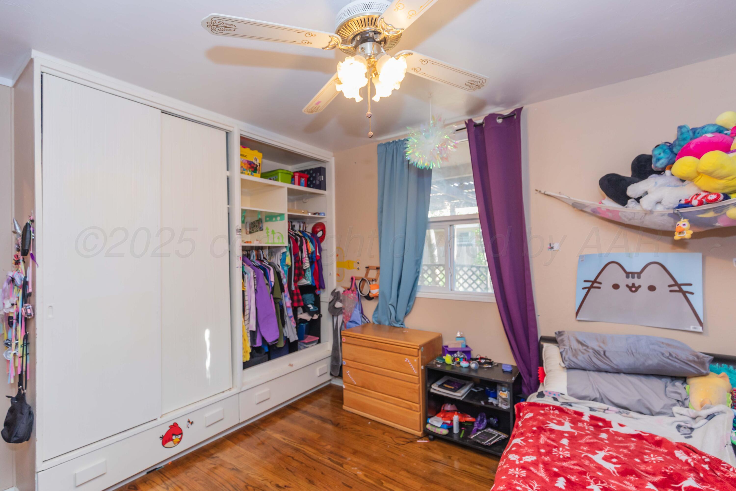 3609 Doris Drive Amarillo, TX 79109 - Photo 16 of 22 a room with furniture and wooden floor