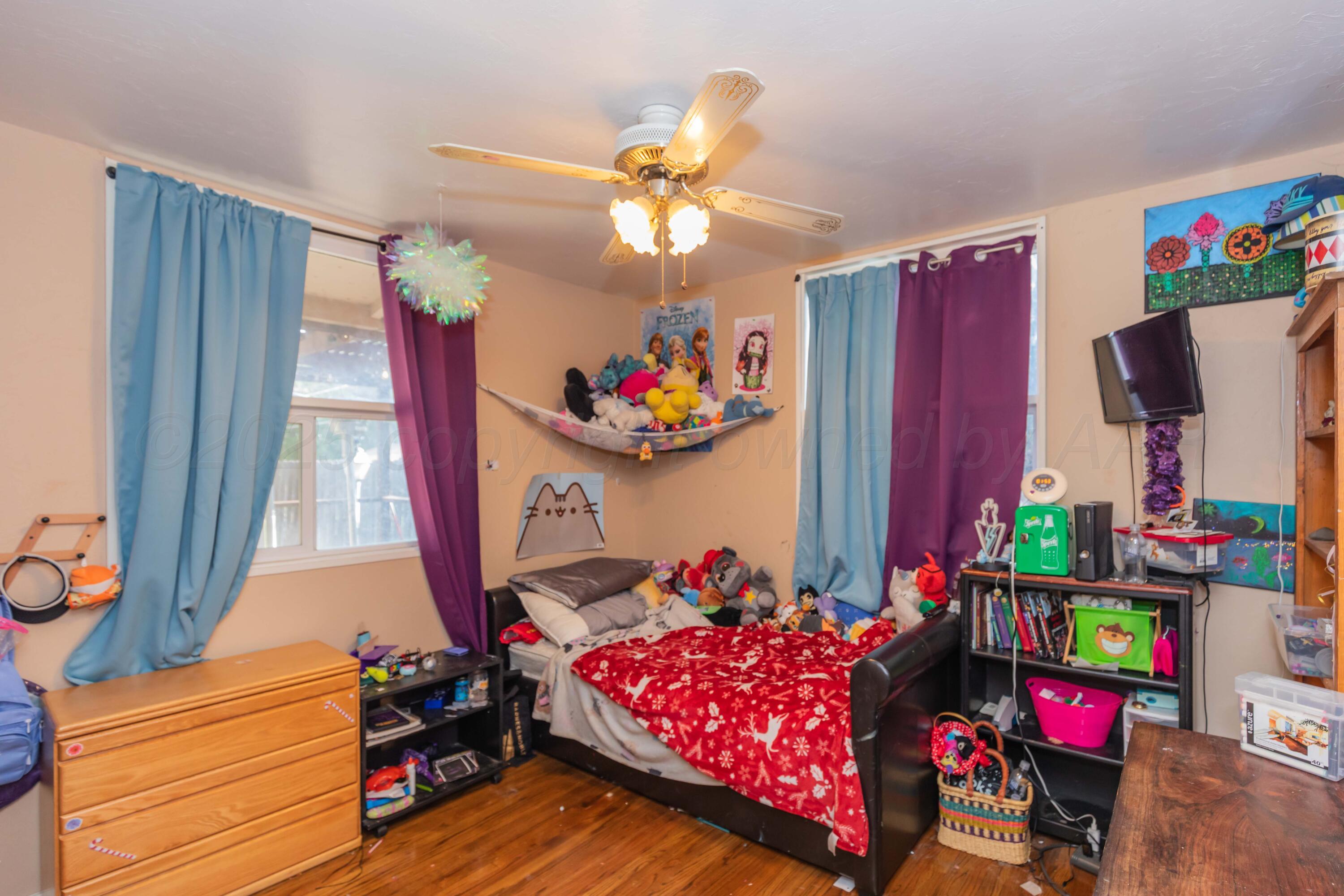 3609 Doris Drive Amarillo, TX 79109 - Photo 17 of 22 a bedroom with toys and a wooden floor