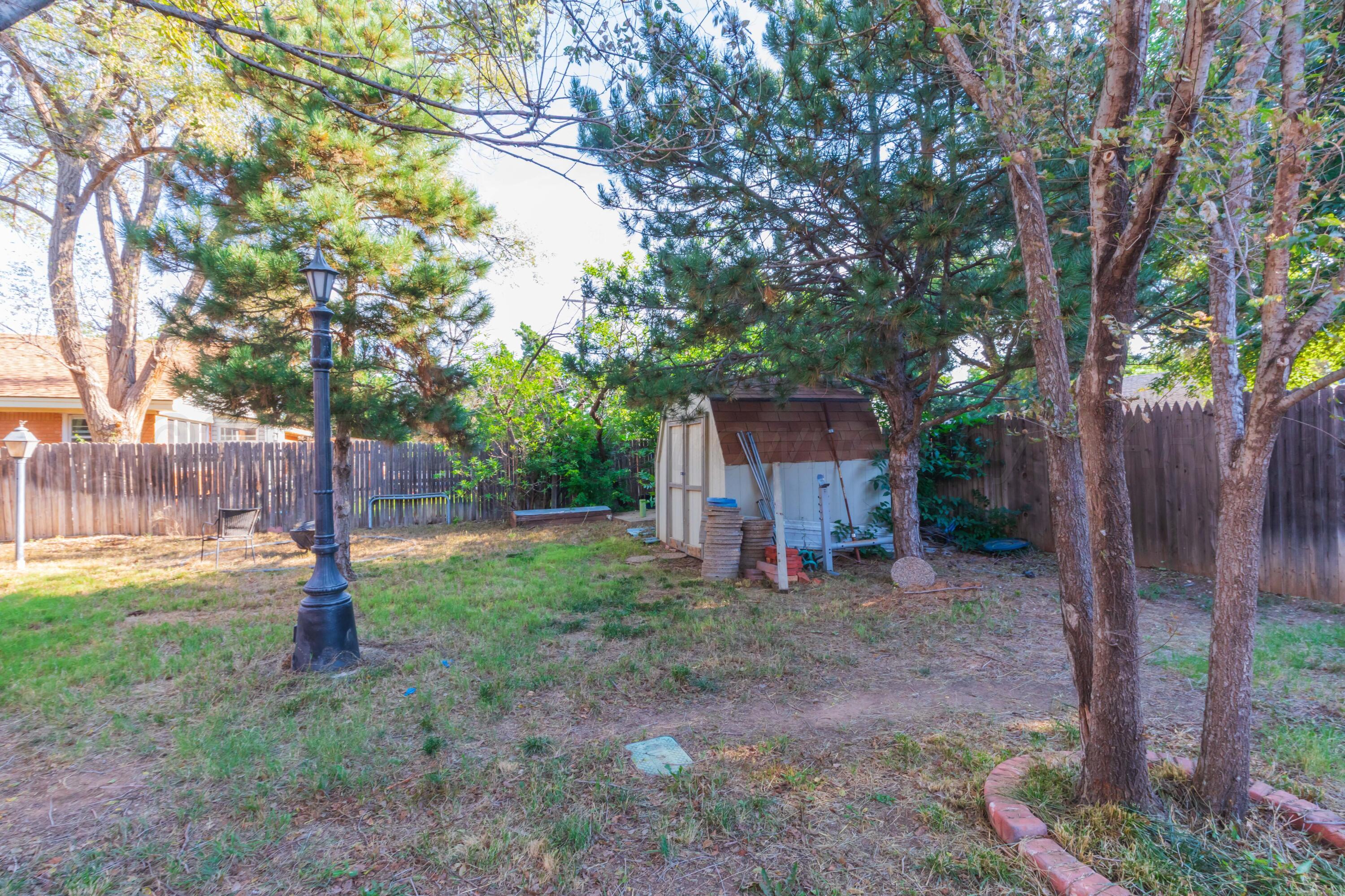 3609 Doris Drive Amarillo, TX 79109 - Photo 20 of 22 a view of a house with a yard and tree s