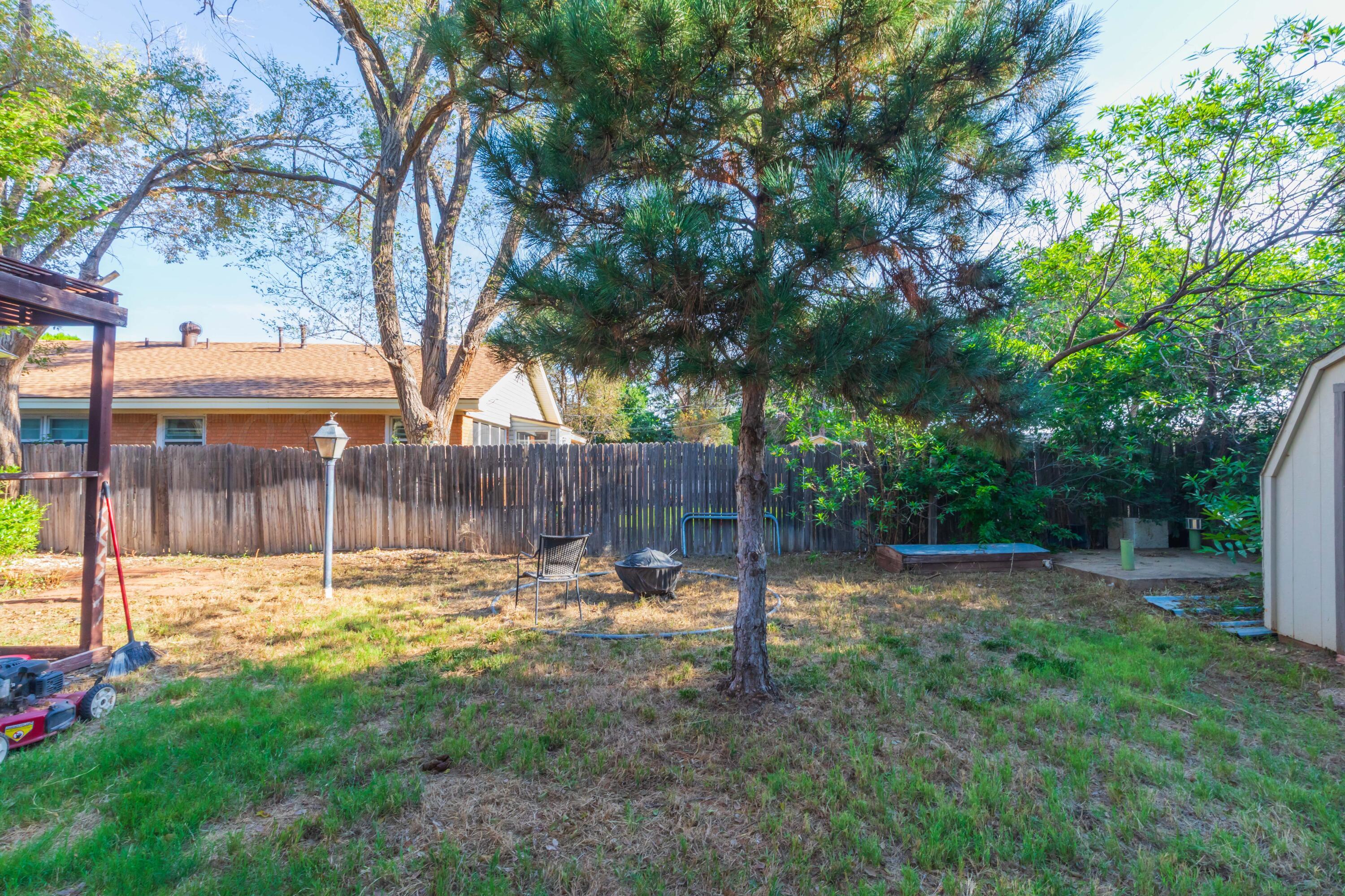 3609 Doris Drive Amarillo, TX 79109 - Photo 21 of 22 a view of a backyard with a tree