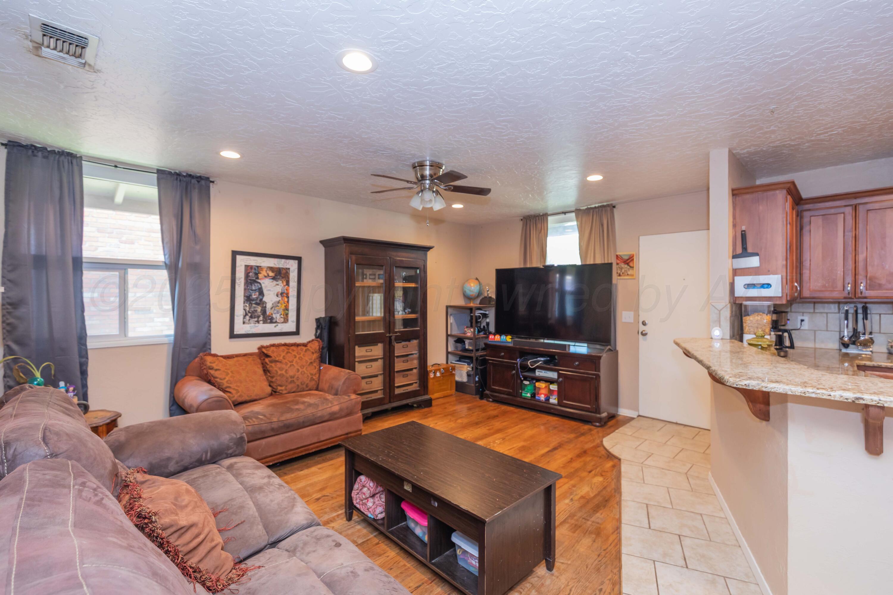 3609 Doris Drive Amarillo, TX 79109 - Photo 3 of 22 a living room with furniture and a flat screen tv