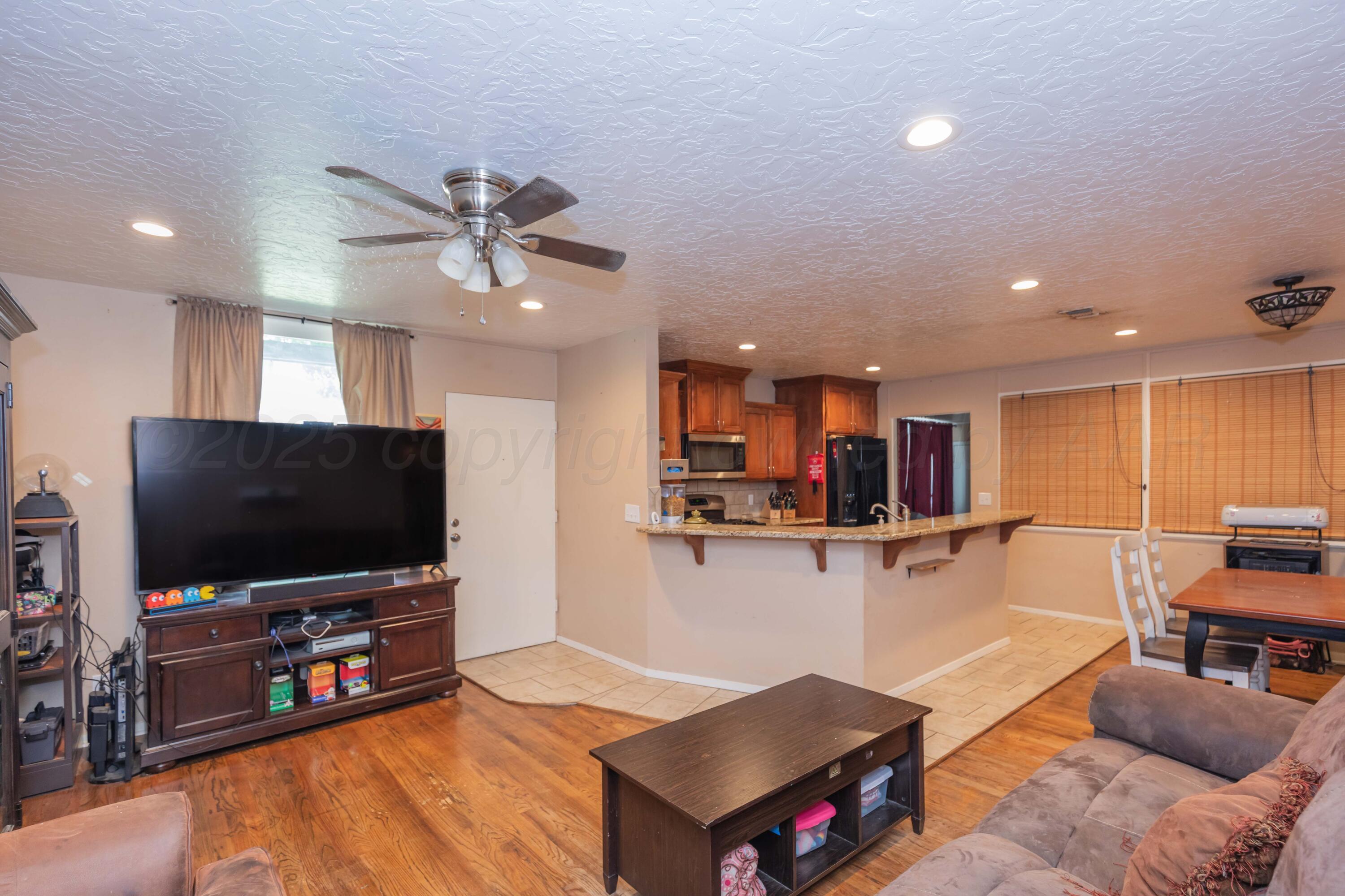 3609 Doris Drive Amarillo, TX 79109 - Photo 4 of 22 a living room with furniture and a flat screen tv