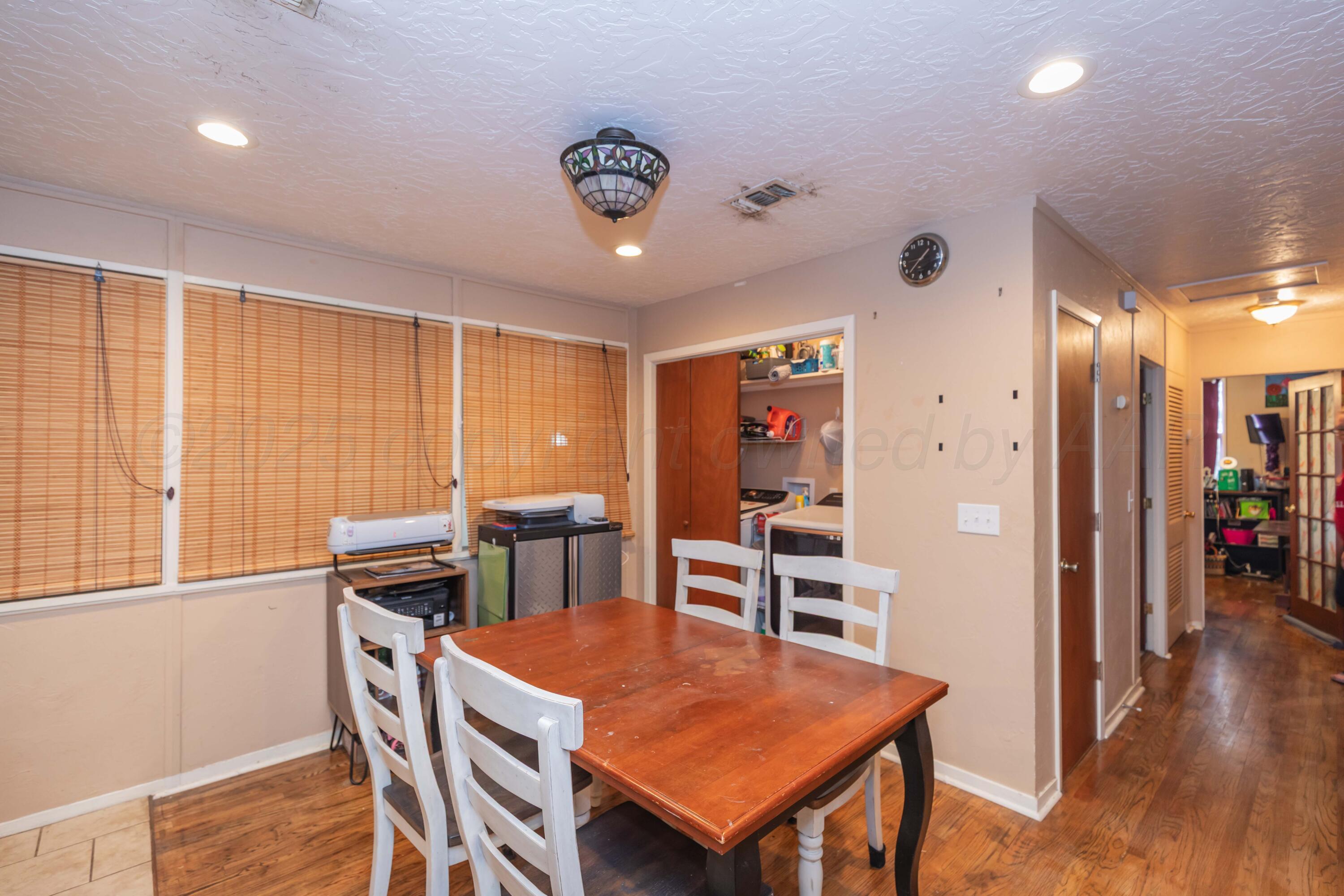 3609 Doris Drive Amarillo, TX 79109 - Photo 8 of 22 a view of a dining room with furniture and wooden floor