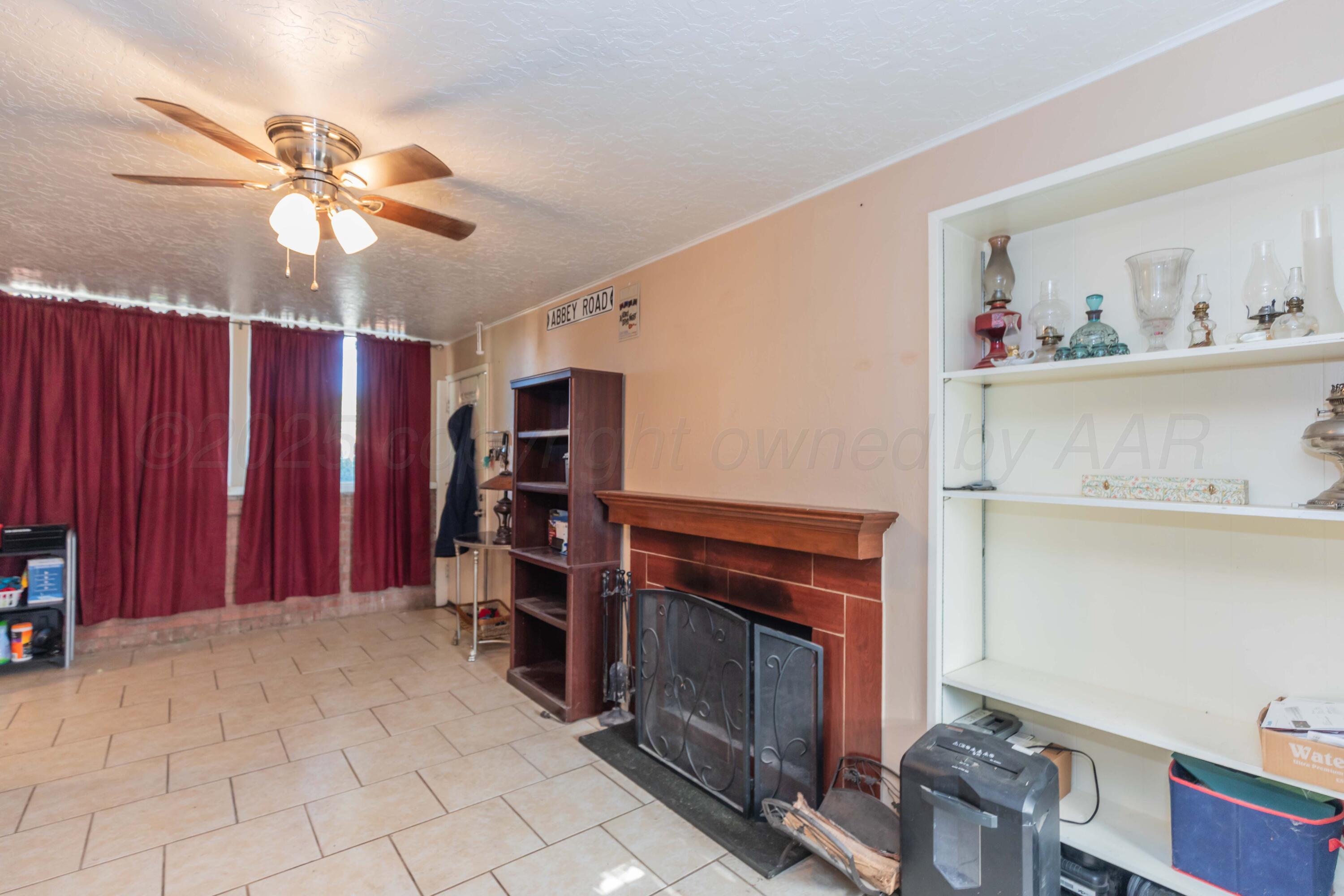 3609 Doris Drive Amarillo, TX 79109 - Photo 9 of 22 a view of a livingroom with furniture and chandelier fan
