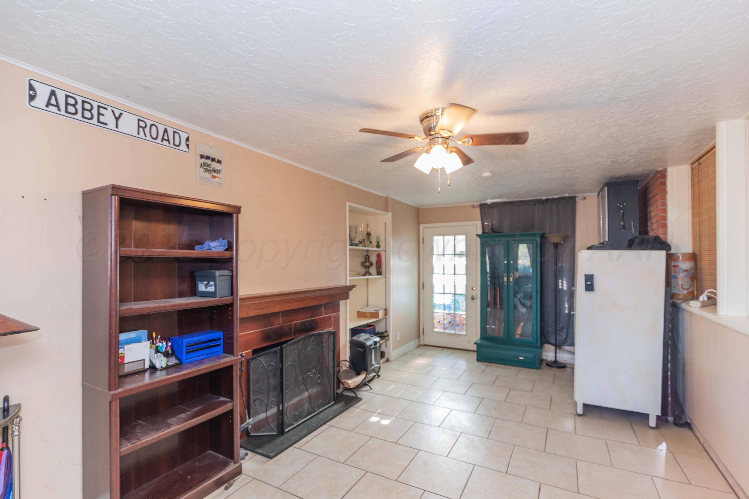3609 Doris Drive Amarillo, TX 79109 - Photo 10 of 22 a open kitchen with stainless steel appliances granite countertop a refrigerator and a stove top oven