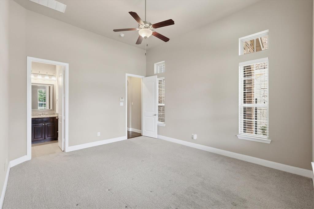 768 Huntingdon Street Coppell, TX 75019 - Photo 6 of 37 Private bedroom suite featuring high ceilings, neutral paint, plush carpet, and direct access to the bathroom.