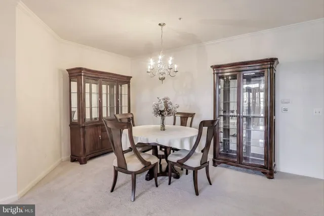 a view of a dining room with furniture and window