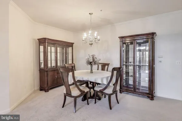 a view of a dining room with furniture and window