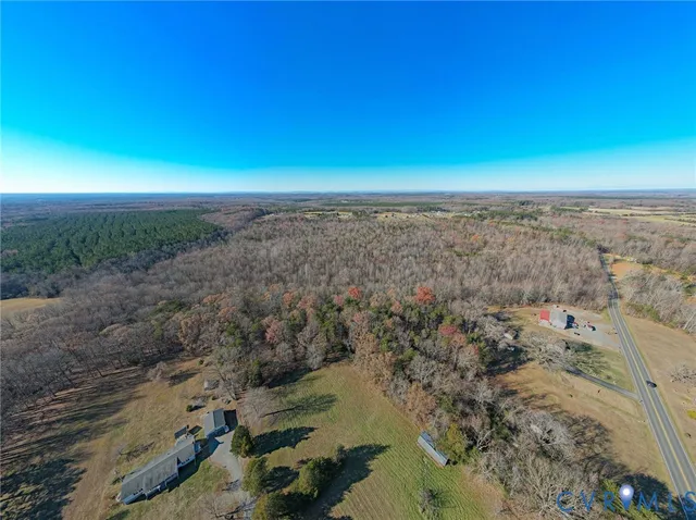 an aerial view of house with yard