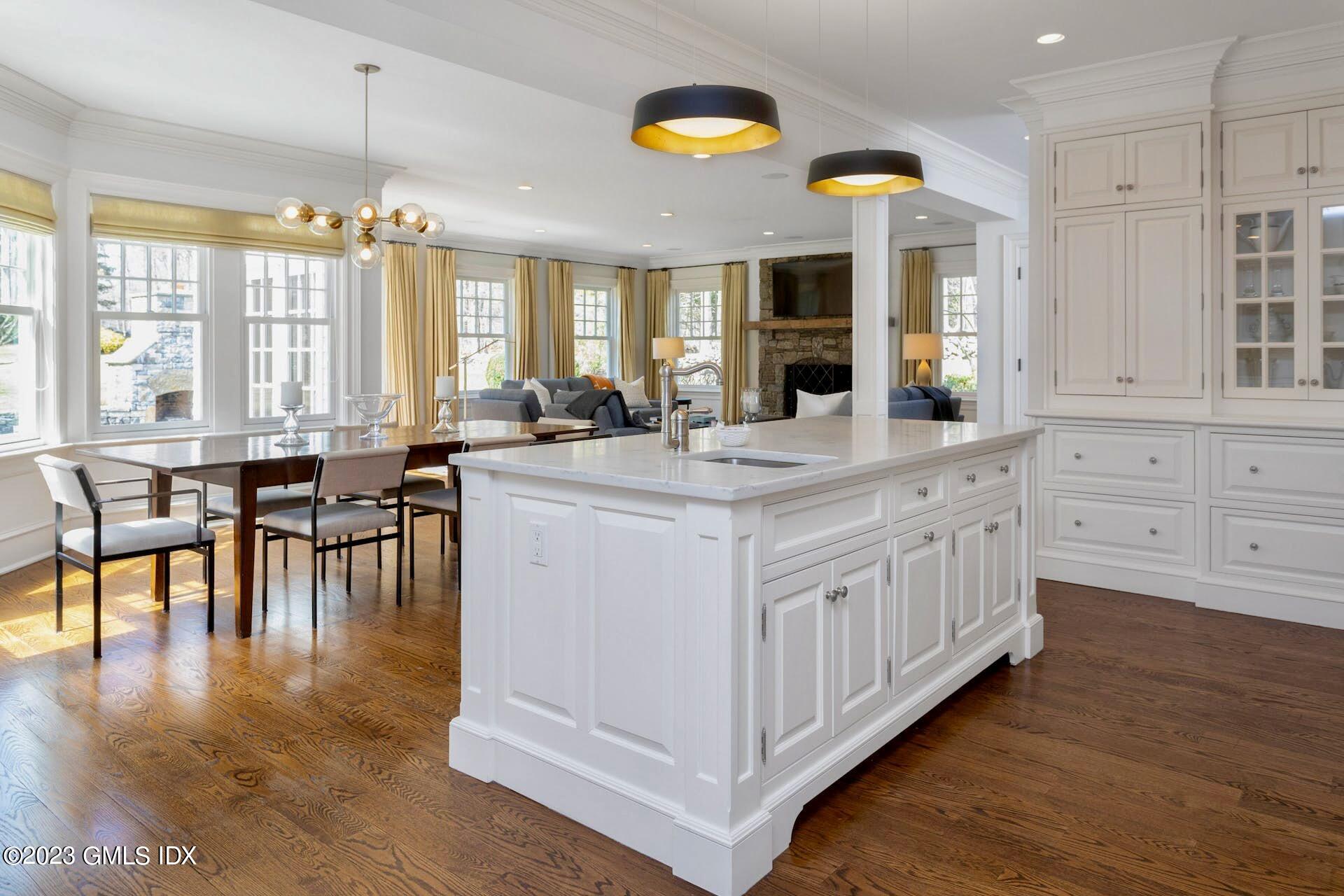154 Cognewaugh Road Cos Cob, CT 06807 - Photo 12 of 46 a kitchen with sink and cabinets