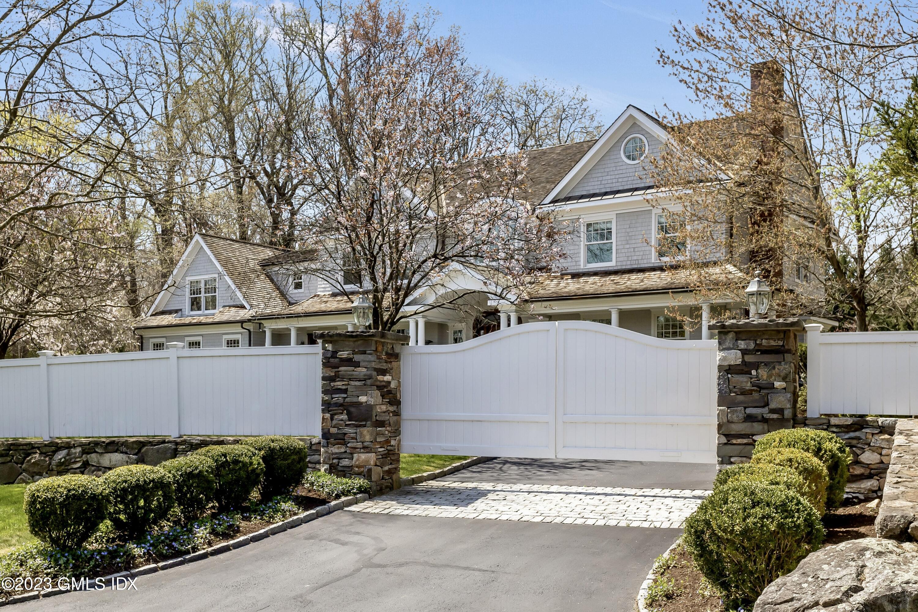 154 Cognewaugh Road Cos Cob, CT 06807 - Photo 39 of 46 a front view of a house with garden