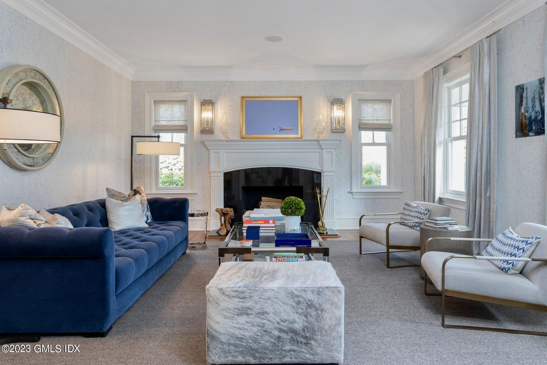 154 Cognewaugh Road Cos Cob, CT 06807 - Photo 6 of 46 a living room with furniture a fireplace and window