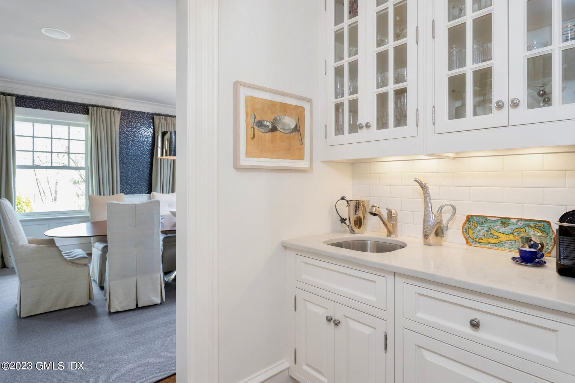 154 Cognewaugh Road Cos Cob, CT 06807 - Photo 8 of 46 a kitchen with a sink cabinets and window