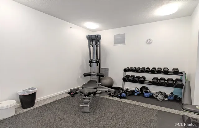 a very nice looking room with a large window and furniture