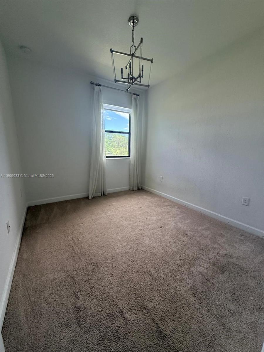 12715 Southwest 230th Terrace, Unit 1 Miami, FL 33170 - Photo 15 of 24 a view of room with window and ceiling fan
