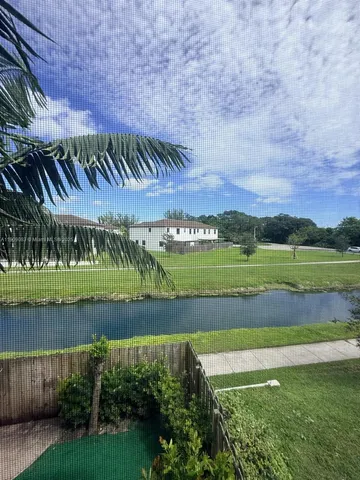a view of a lake with a big yard