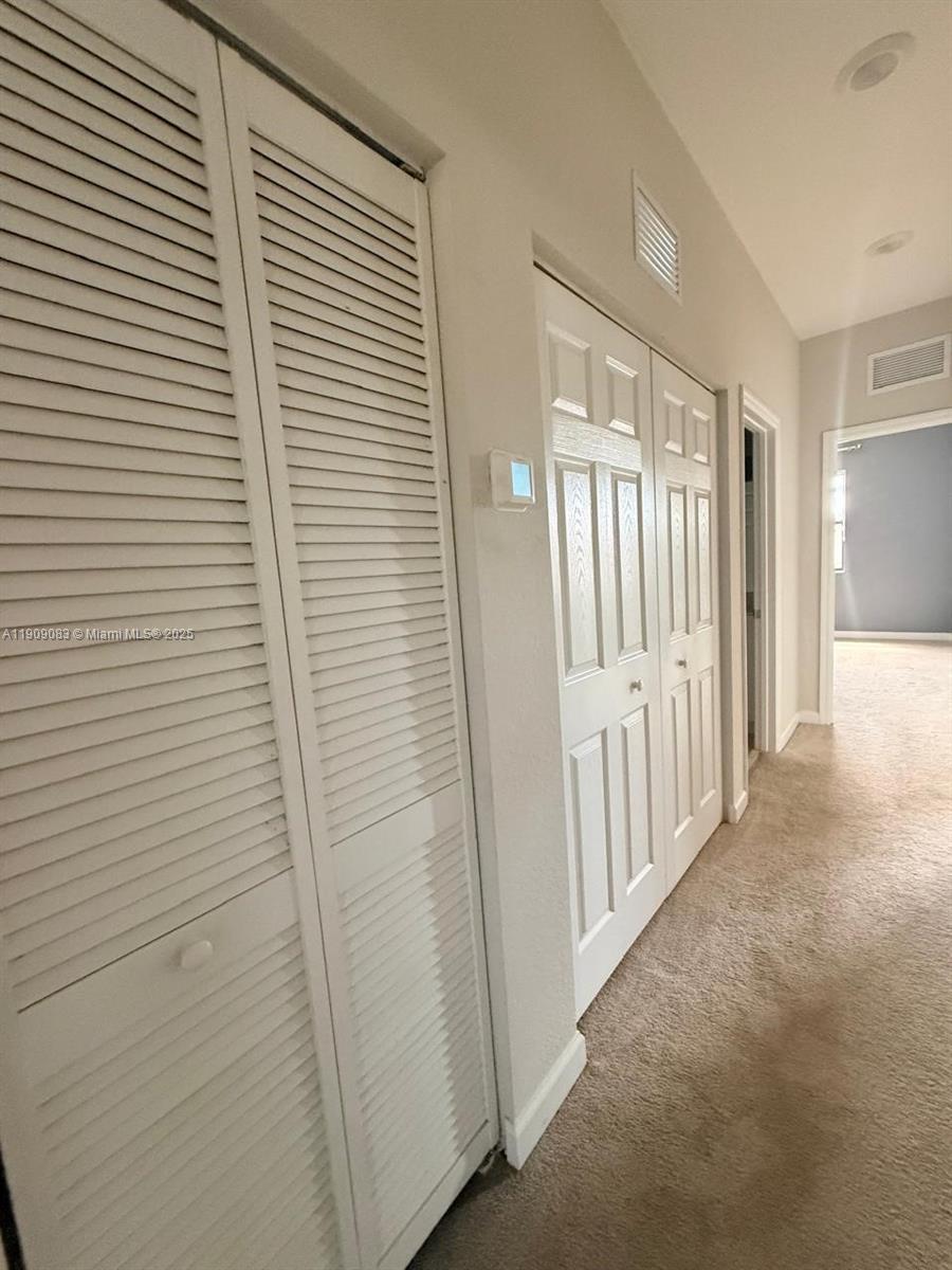 12715 Southwest 230th Terrace, Unit 1 Miami, FL 33170 - Photo 20 of 24 a view of a livingroom with a window