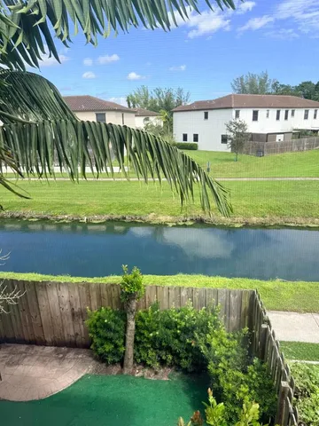 a view of a lake with a building in the background
