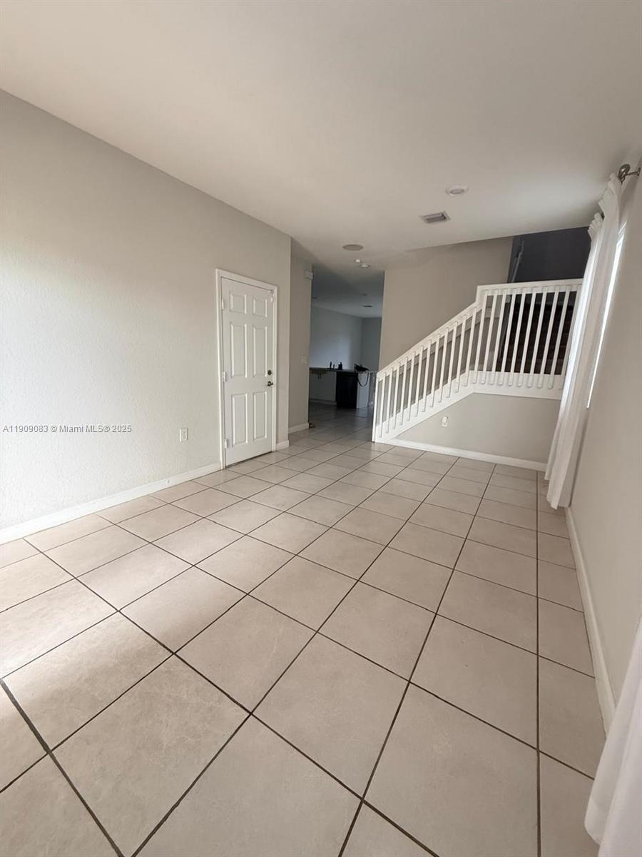 12715 Southwest 230th Terrace, Unit 1 Miami, FL 33170 - Photo 5 of 24 a view of an empty room