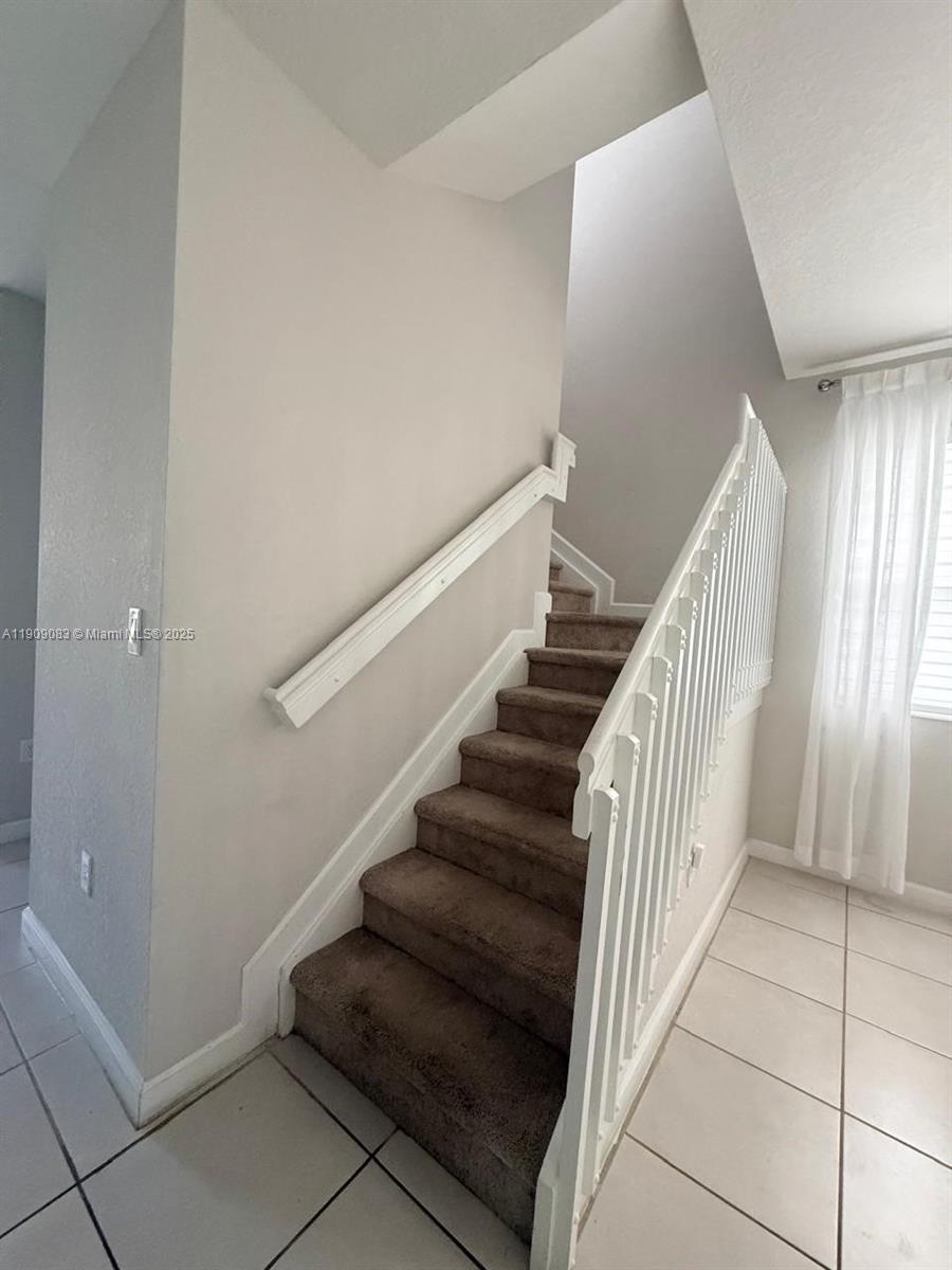 12715 Southwest 230th Terrace, Unit 1 Miami, FL 33170 - Photo 6 of 24 a view of entryway and hall with wooden floor