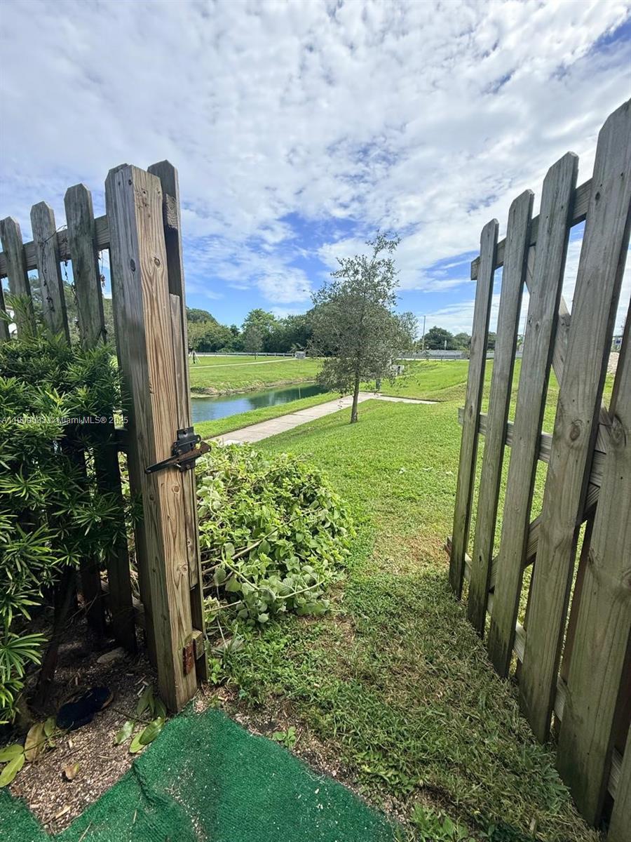 12715 Southwest 230th Terrace, Unit 1 Miami, FL 33170 - Photo 10 of 24 a view of a garden with a large tree