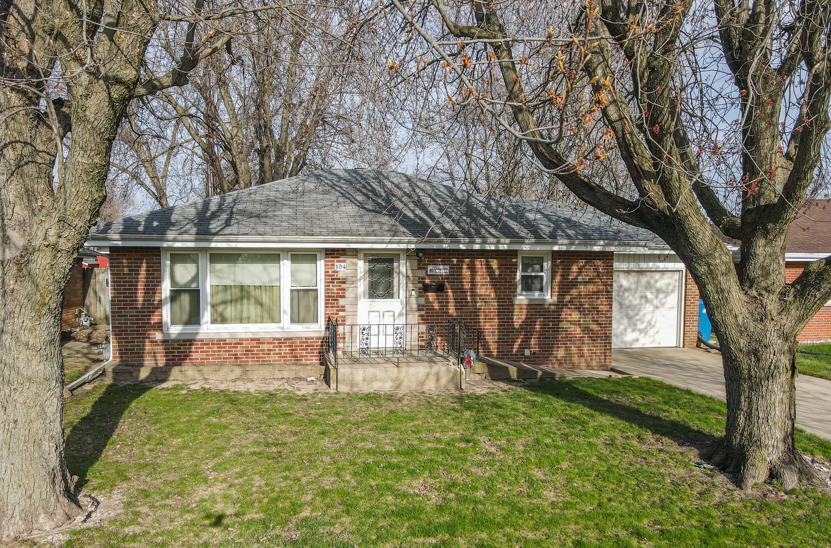 front view of a house with a yard