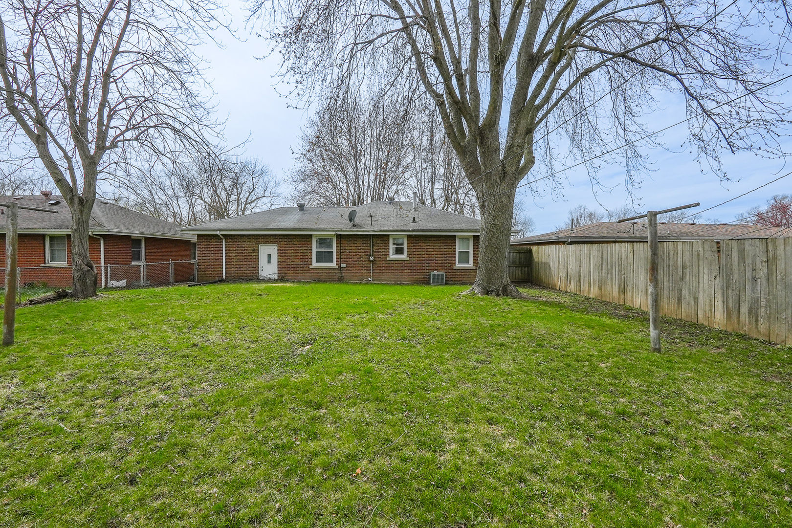 304 Ashley Avenue Bourbonnais, IL 60914 - Photo 16 of 18 a view of a house with a yard