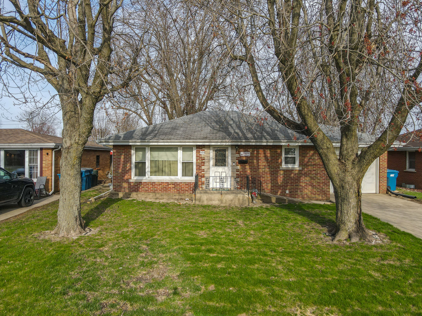 304 Ashley Avenue Bourbonnais, IL 60914 - Photo 2 of 18 a view of a house with a yard