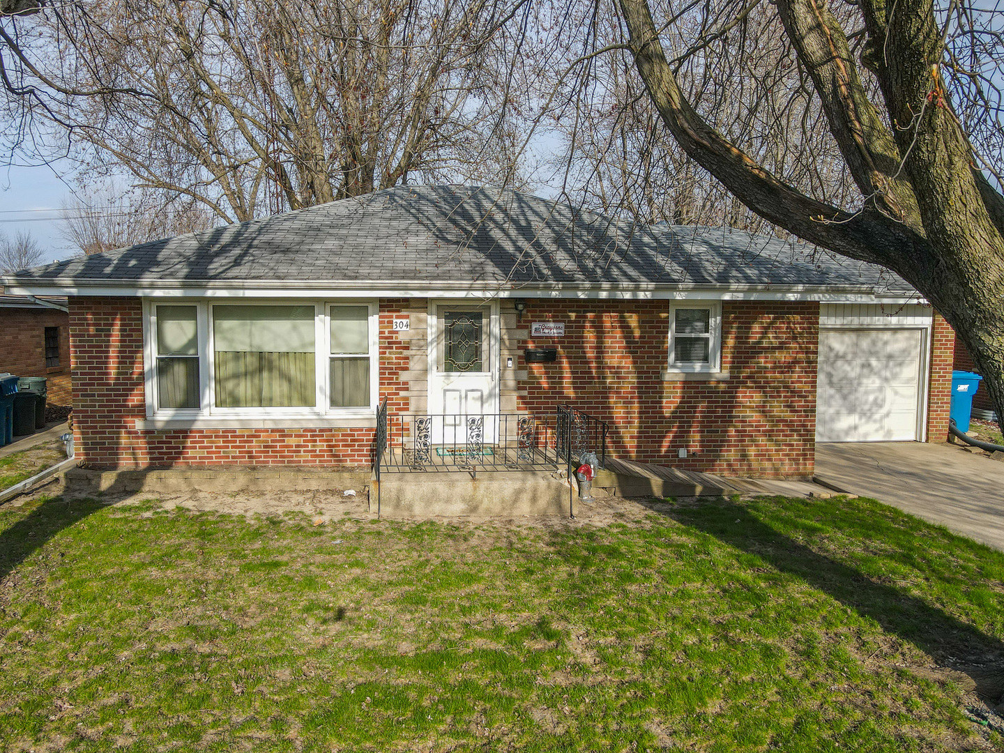 304 Ashley Avenue Bourbonnais, IL 60914 - Photo 3 of 18 front view of house with a yard