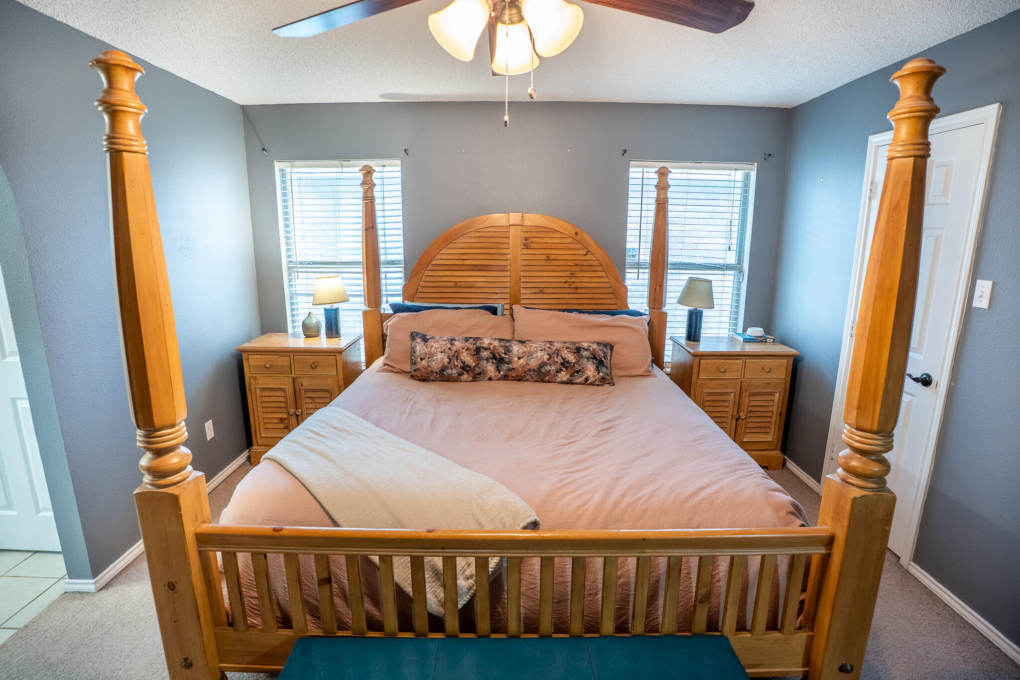 1609 78th Street Lubbock, TX 79423 - Photo 15 of 36 a bed sitting in a bedroom next to a window