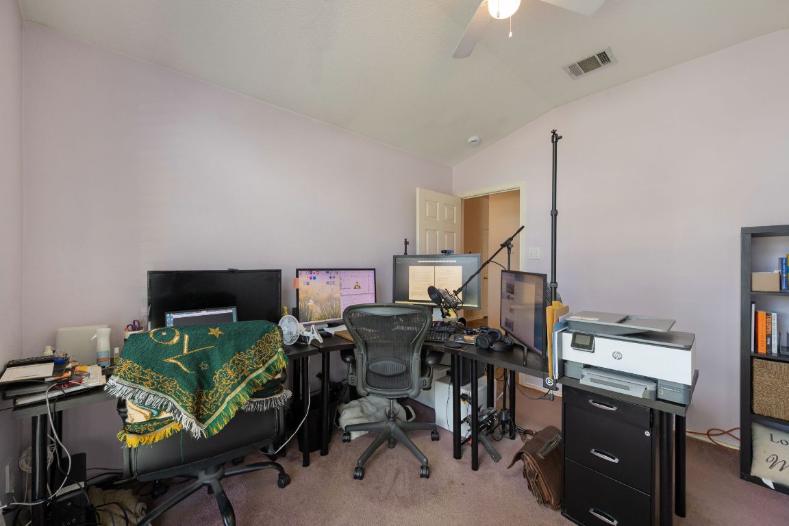 14505 Sandifer Street Austin, TX 78725 - Photo 17 of 28 a view of a workspace with furniture and a utility room