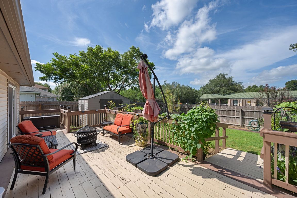 14505 Sandifer Street Austin, TX 78725 - Photo 22 of 28 a view of a house with backyard sitting area and garden