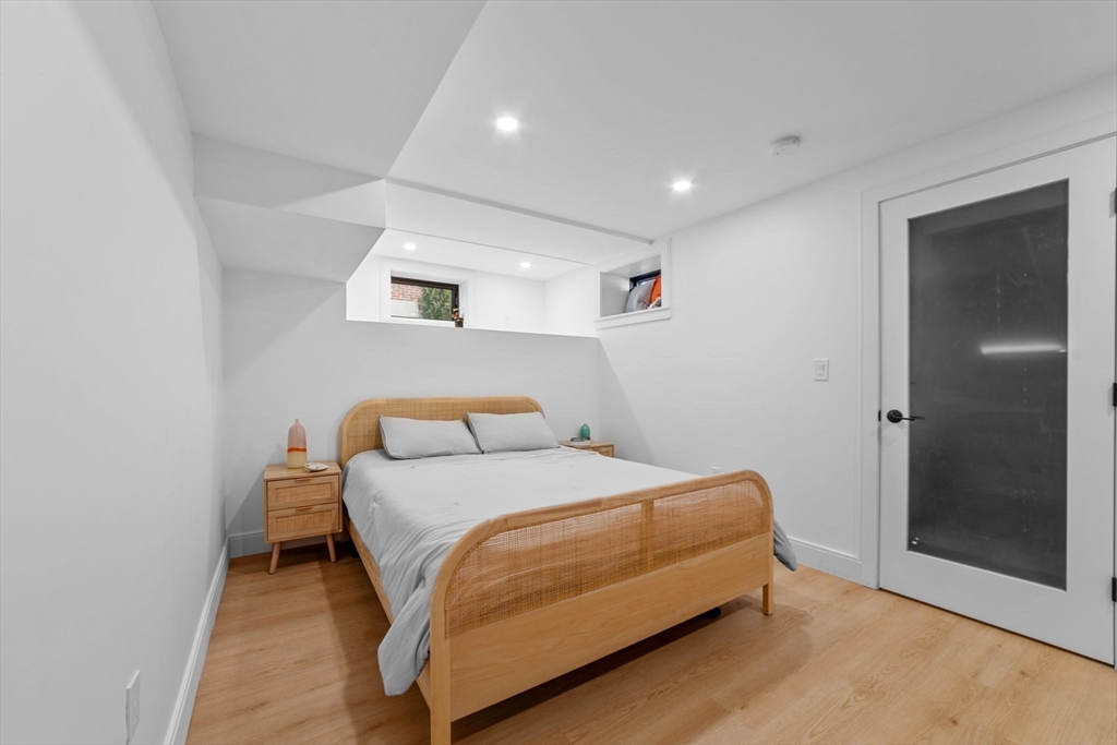 45 Rowena Road Newton, MA 02459 - Photo 21 of 42 a bedroom with a bed and a window