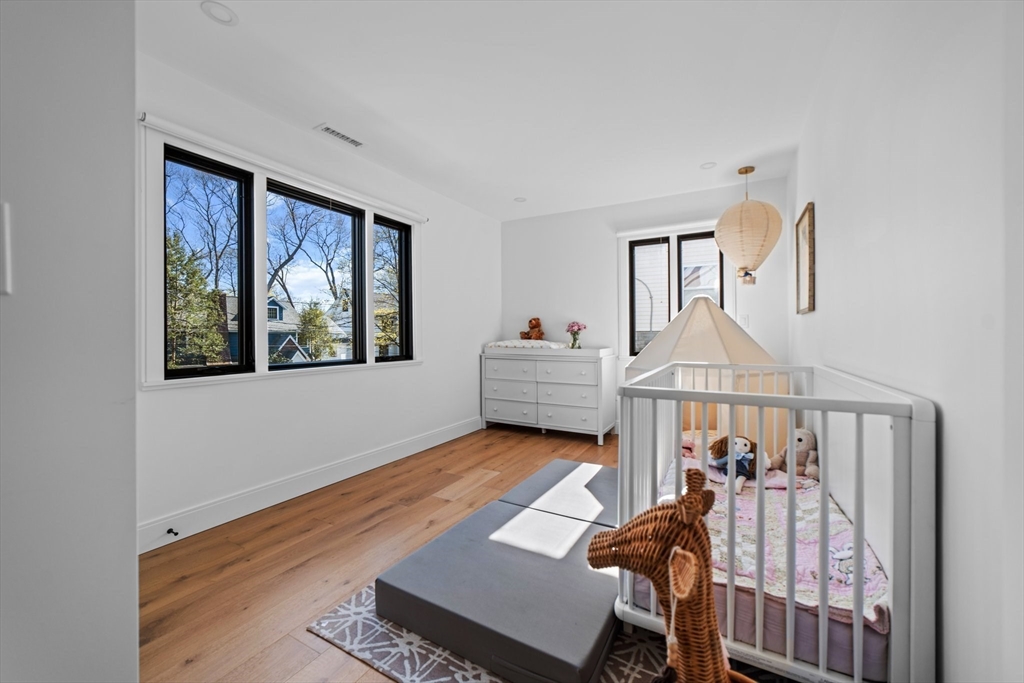45 Rowena Road Newton, MA 02459 - Photo 22 of 42 a living room with furniture and a window