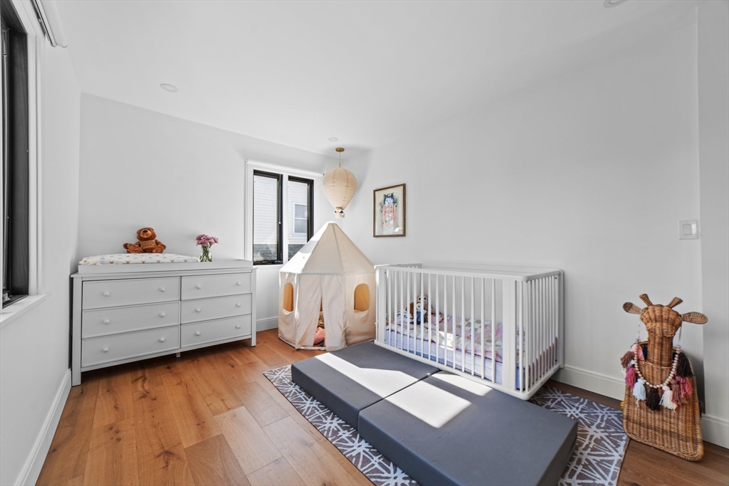 45 Rowena Road Newton, MA 02459 - Photo 23 of 42 a bedroom with furniture and a window