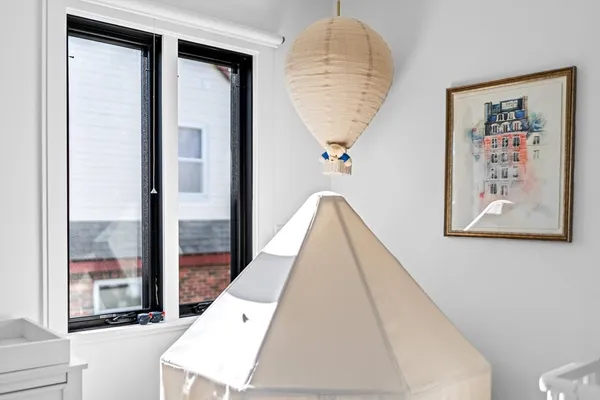a bedroom with bed and window