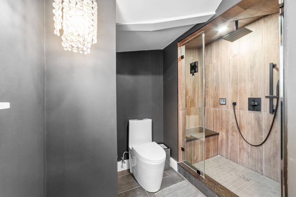 45 Rowena Road Newton, MA 02459 - Photo 30 of 42 a bathroom with a toilet and a shower
