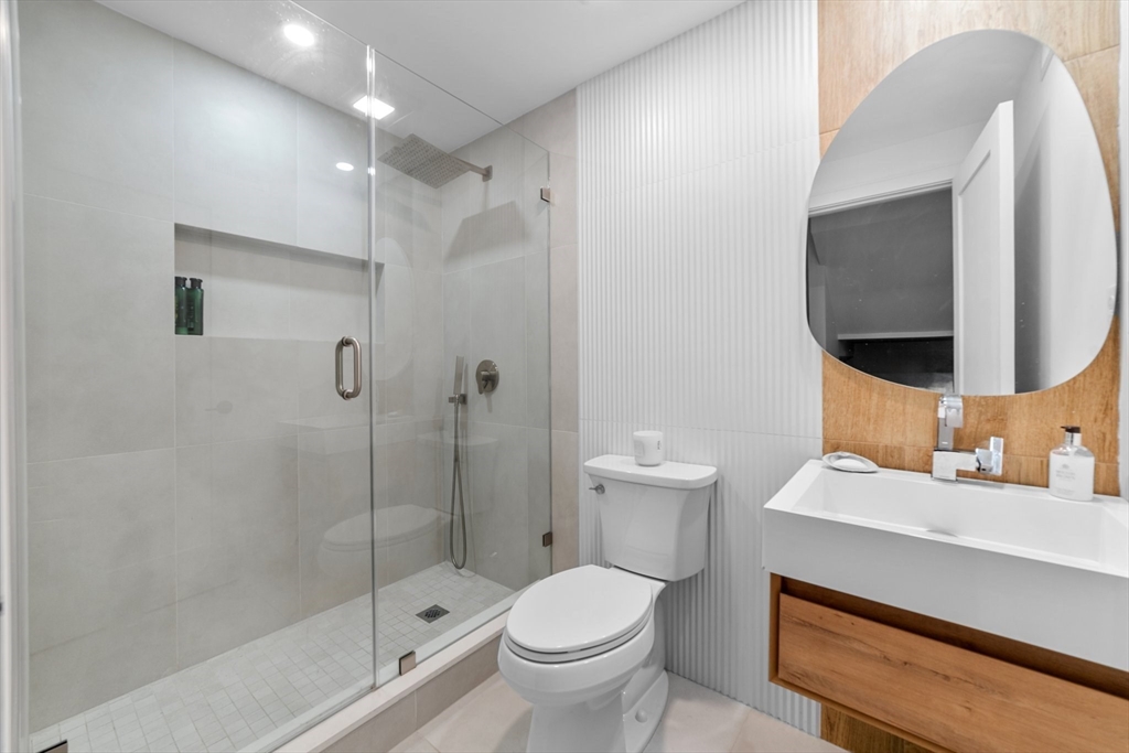 45 Rowena Road Newton, MA 02459 - Photo 31 of 42 a bathroom with a sink toilet and shower