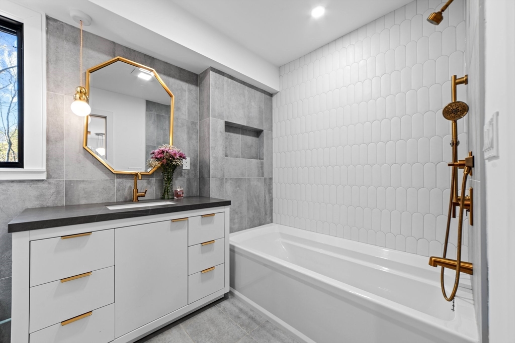 45 Rowena Road Newton, MA 02459 - Photo 34 of 42 a bathroom with a bathtub and a sink