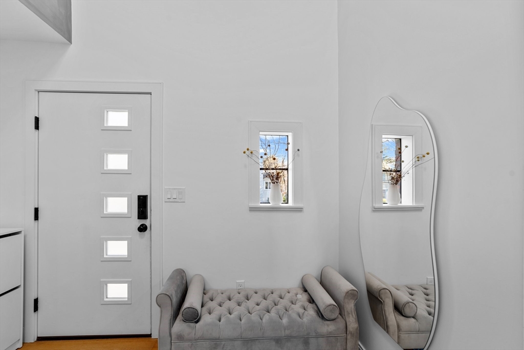 45 Rowena Road Newton, MA 02459 - Photo 36 of 42 a living room with furniture and a window