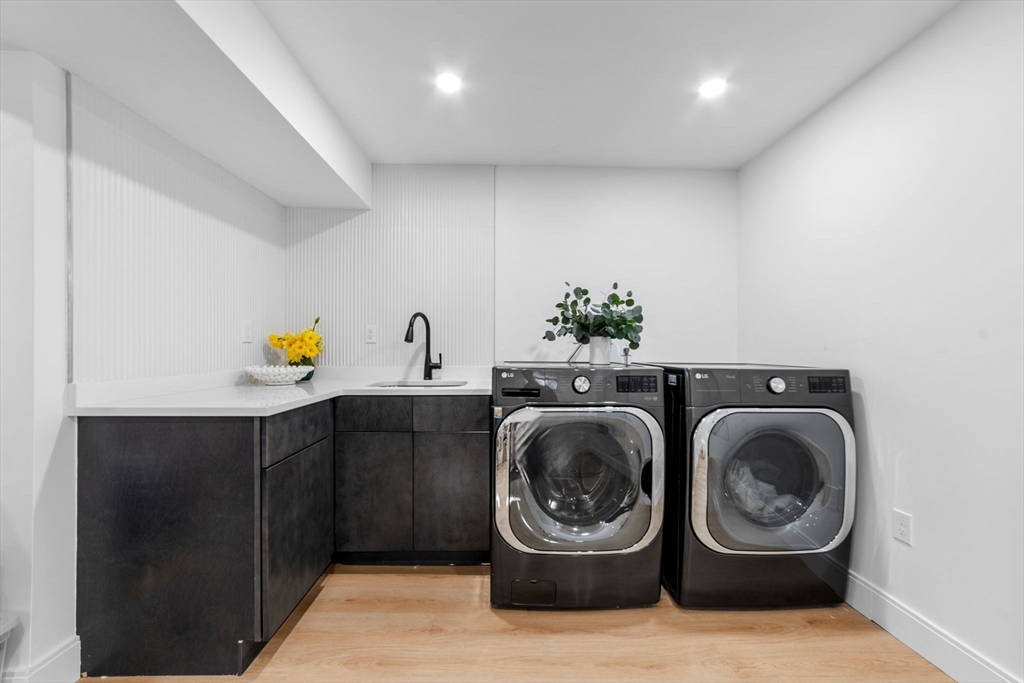 45 Rowena Road Newton, MA 02459 - Photo 37 of 42 a storage room with washer and dryer