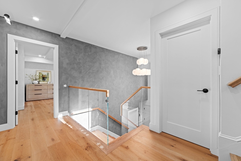 45 Rowena Road Newton, MA 02459 - Photo 39 of 42 a view of entryway and hall with wooden floor