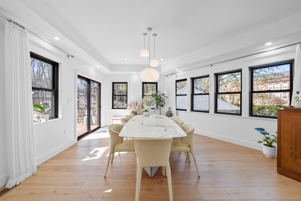 45 Rowena Road Newton, MA 02459 - Photo 4 of 42 a view of a dining room with furniture a chandelier and wooden floor