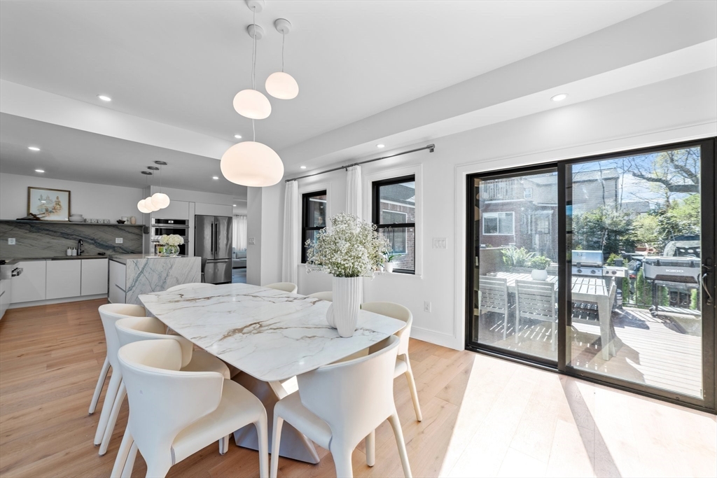 45 Rowena Road Newton, MA 02459 - Photo 7 of 42 a view of a dining room with furniture window and wooden floor