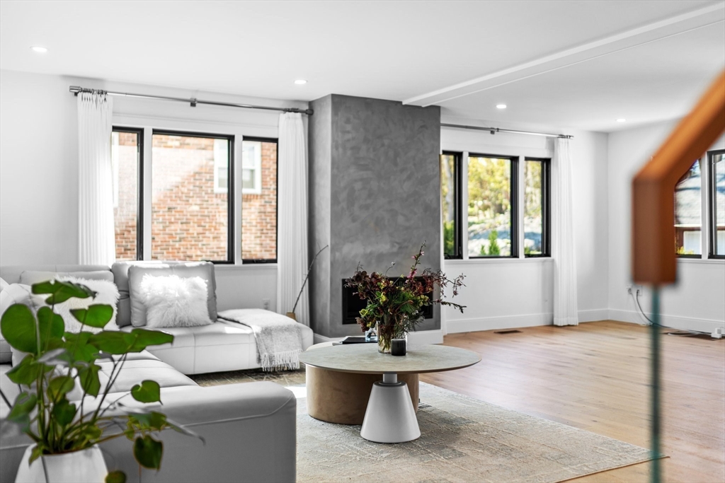 45 Rowena Road Newton, MA 02459 - Photo 8 of 42 a living room with furniture and a potted plant