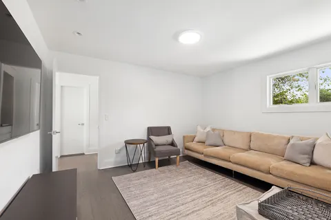 a living room with furniture and a rug