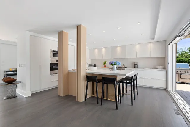 a kitchen with stainless steel appliances a sink stove and a refrigerator